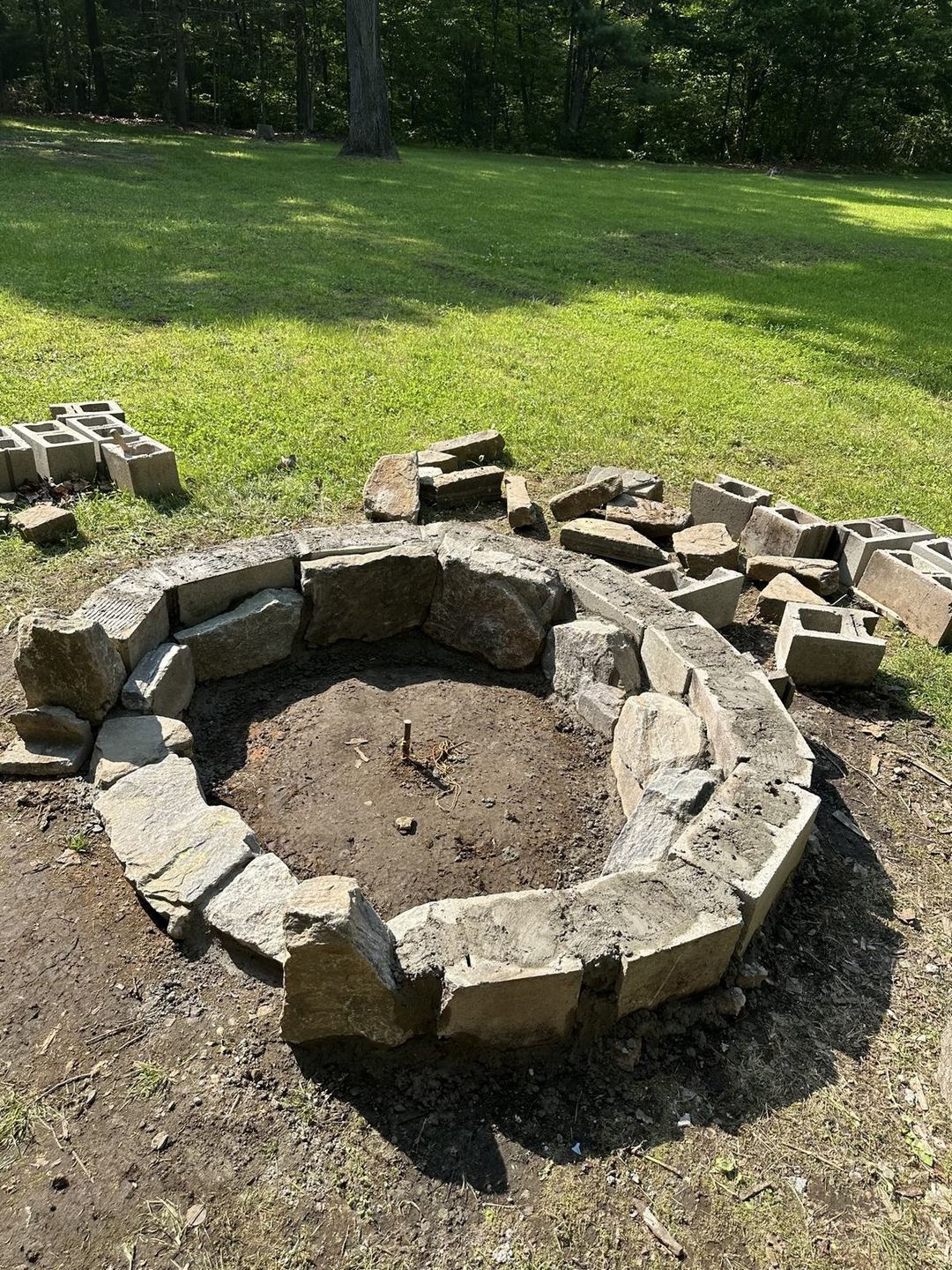 Fire pit base ring set and leveled in the yard